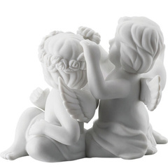 Para aniołów małych z kwiatami